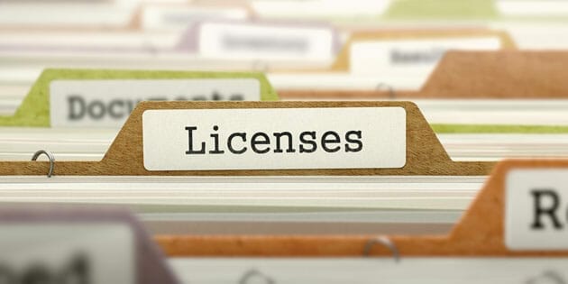 A file folder with the word licenses on it.