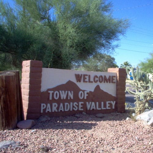 Welcome sign for the town of paradise valley.